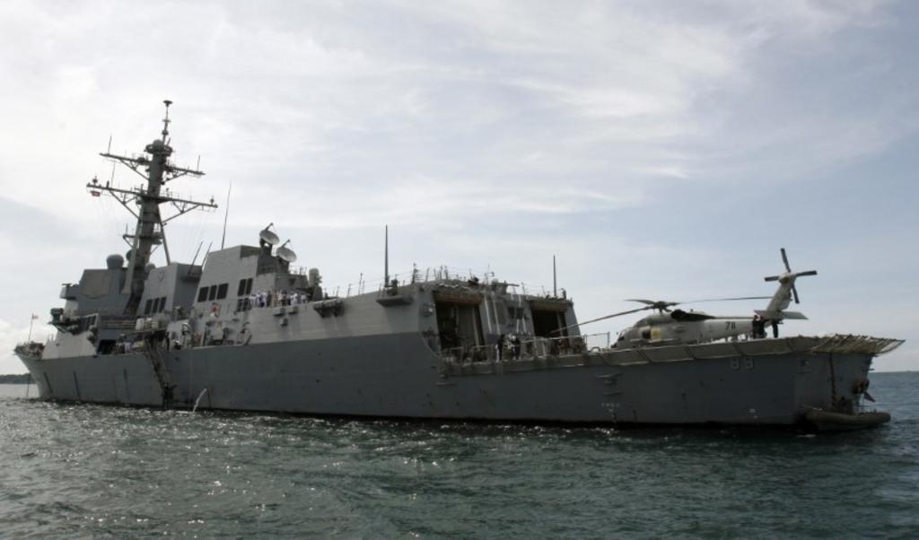 US warship sails near disputed islands in South China Sea, officials say
