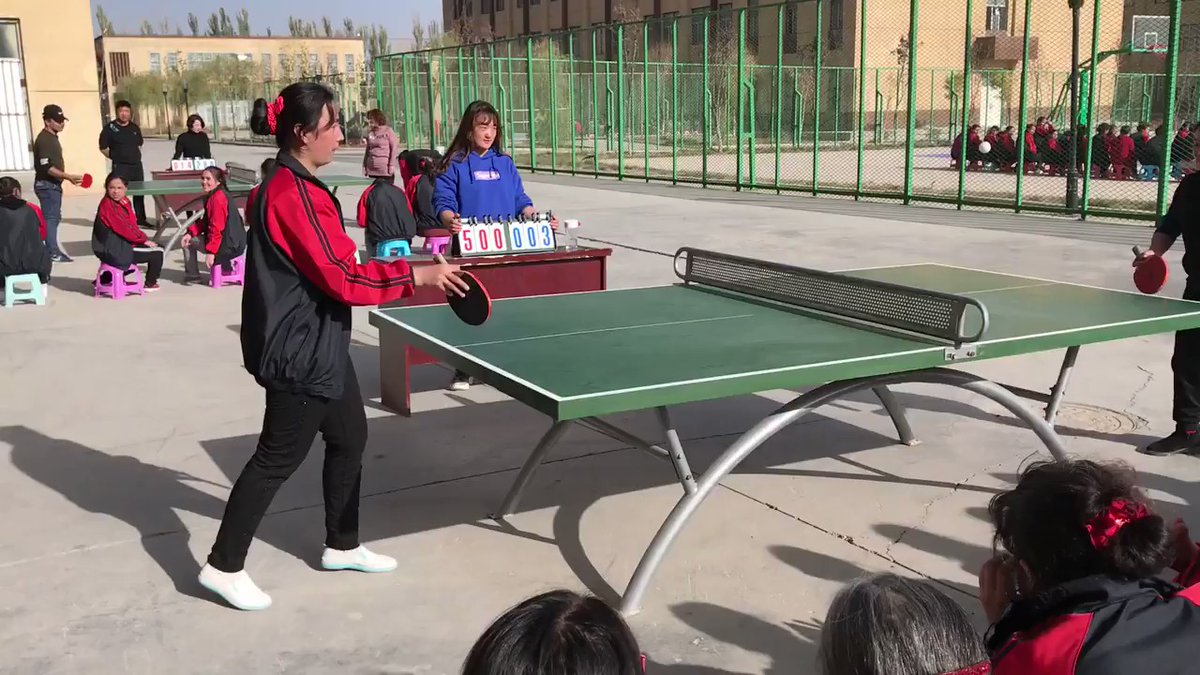 Recent footage filmed by The Global Times (showing a political Re-education Camp in Xinjiang is located at 39.454351, 76.107988. The basketball 'courts' are merely mats and there for propaganda purposes (usually they are at a nearby school: 39.44, 76.09)   