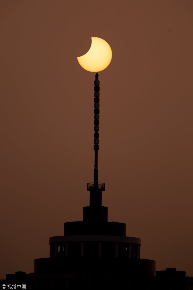 CGTN:The first partial solar eclipse in 2019, captured by photographers in Beijing   