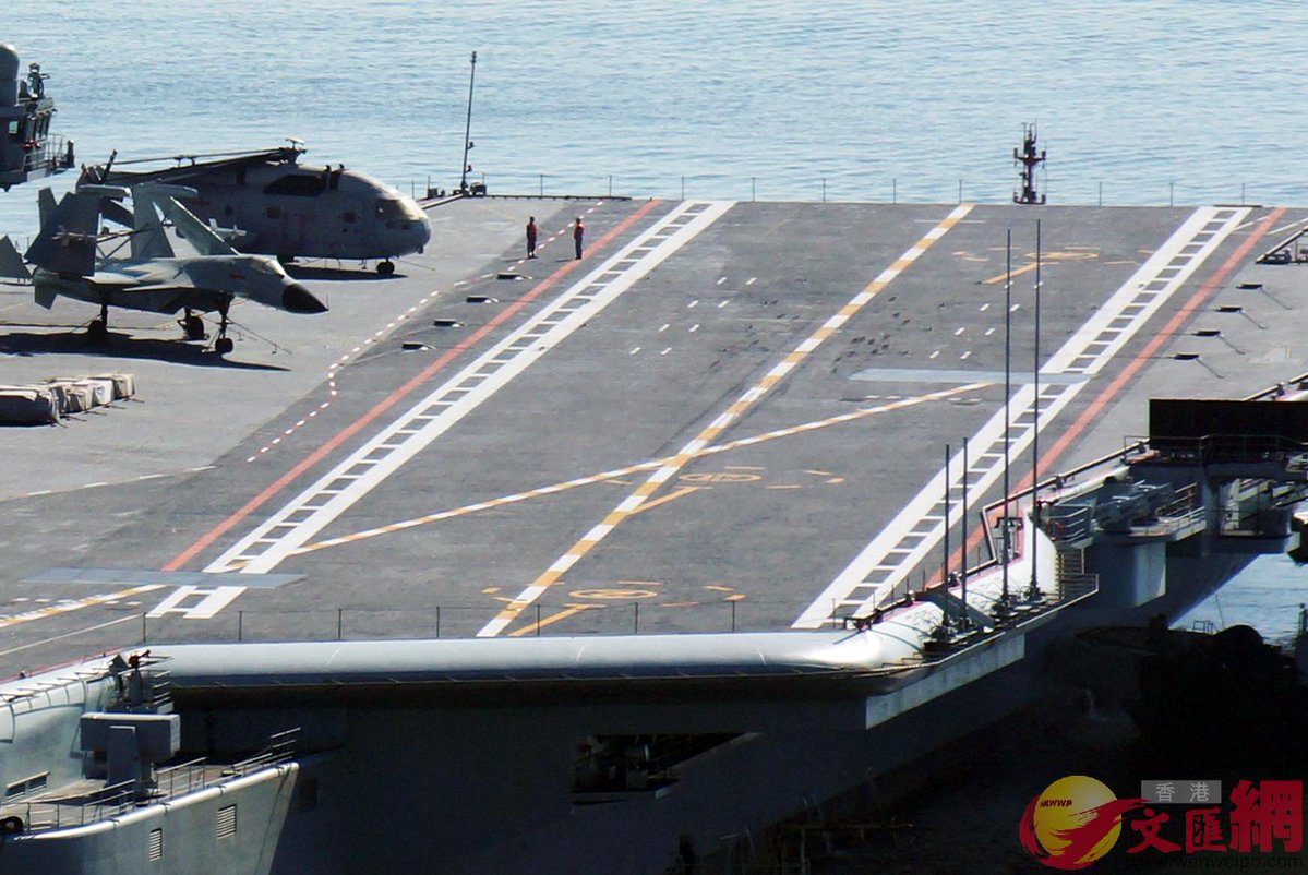 China's second aircraft carrier returned to Dalian Friday 31 May with tire marks clearly visible on the flight deck, indicating the J-15 fighter seen on deck may have conducted the ship's initial flying trials.   