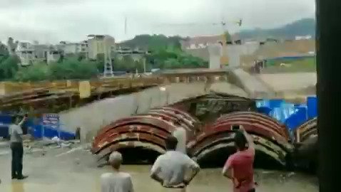 Video captured the moment when flood washed away a half-done bridge in south China's Guangxi Zhuang Autonomous Region. At least 1 person was killed and 4 others missing as of Sunday amid the heavy downpours and floods in the region.   
