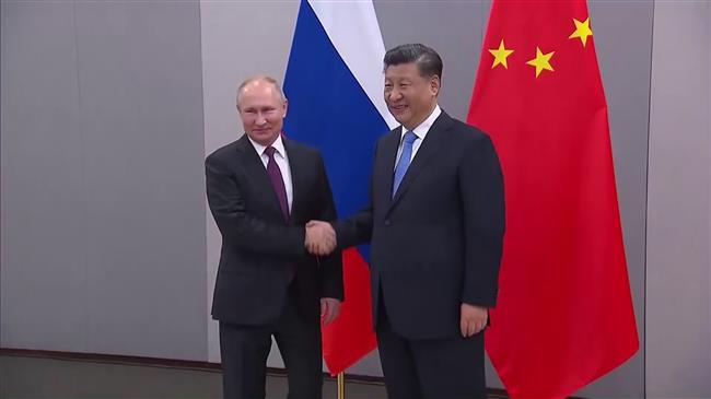 Putin, Xi meet on sidelines of Brasilia summit 