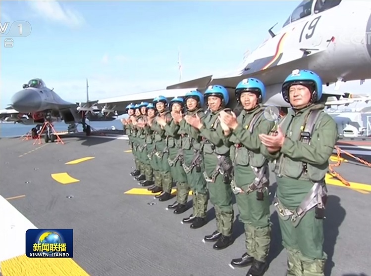 First clear images of the Type 002 carrier's commissioning into PLAN service as the number '17' and named as Shandong.  (Images  CCTV-1)