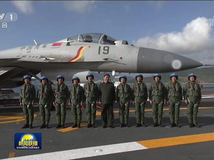 First clear images of the Type 002 carrier's commissioning into PLAN service as the number '17' and named as Shandong.  (Images  CCTV-1)