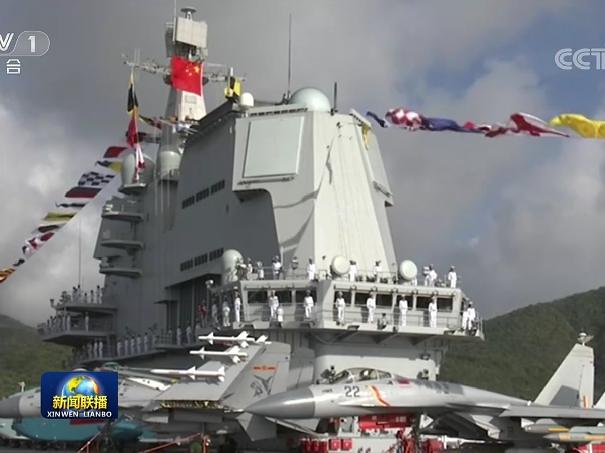 First clear images of the Type 002 carrier's commissioning into PLAN service as the number '17' and named as Shandong.  (Images  CCTV-1)