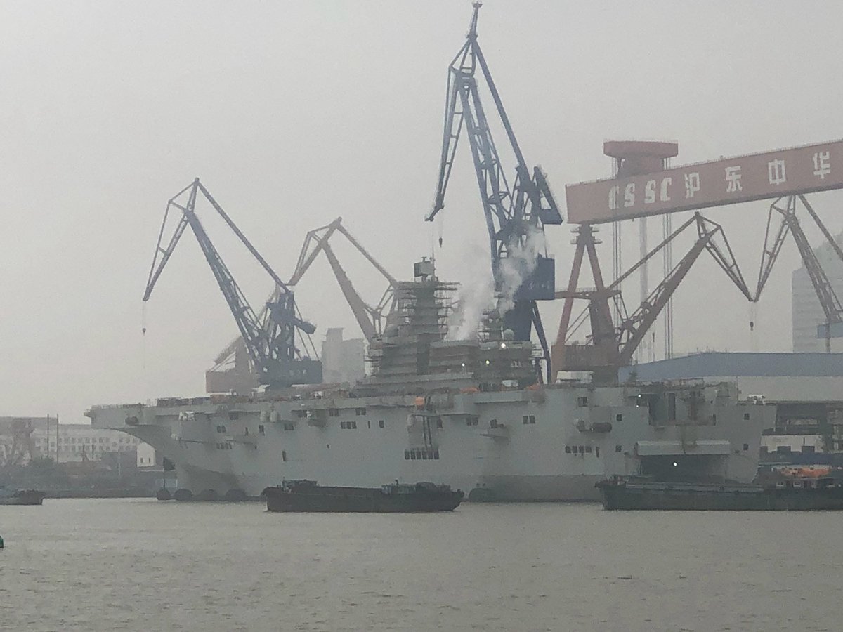 The Chinese PLAN Navy's first two Type 075 amphibious assault ships fitting out in Shanghai at Hudong China Shipbuilding Group. The first ship was launched 26 Sept., the 2nd on 22 April.